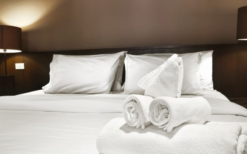 white towels prepared on bed